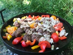 frying meat and vegetables